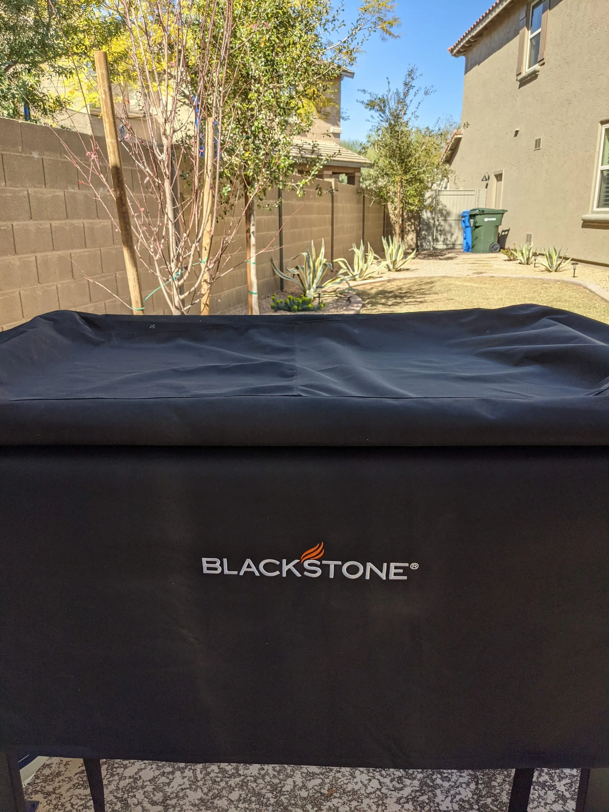 Blackstone griddle cover protecting a flat-top griddle from weather and rust
