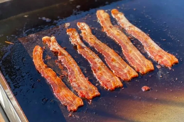Crispy bacon cooked on a Blackstone griddle